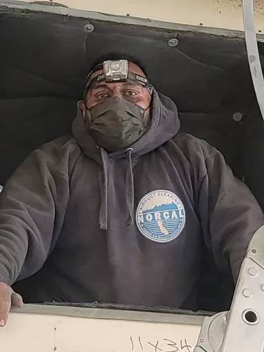 Tech inside commercial air duct system